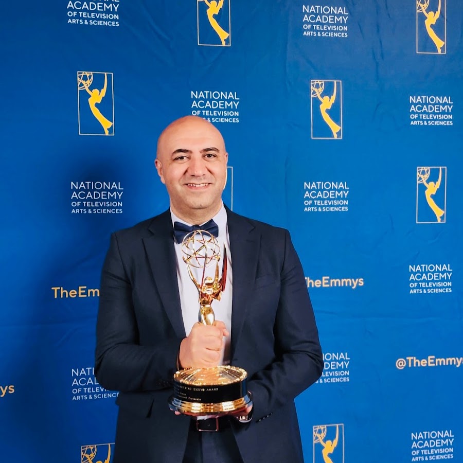 Imed Bouazizi holding the Technology and Engineering Emmy Award